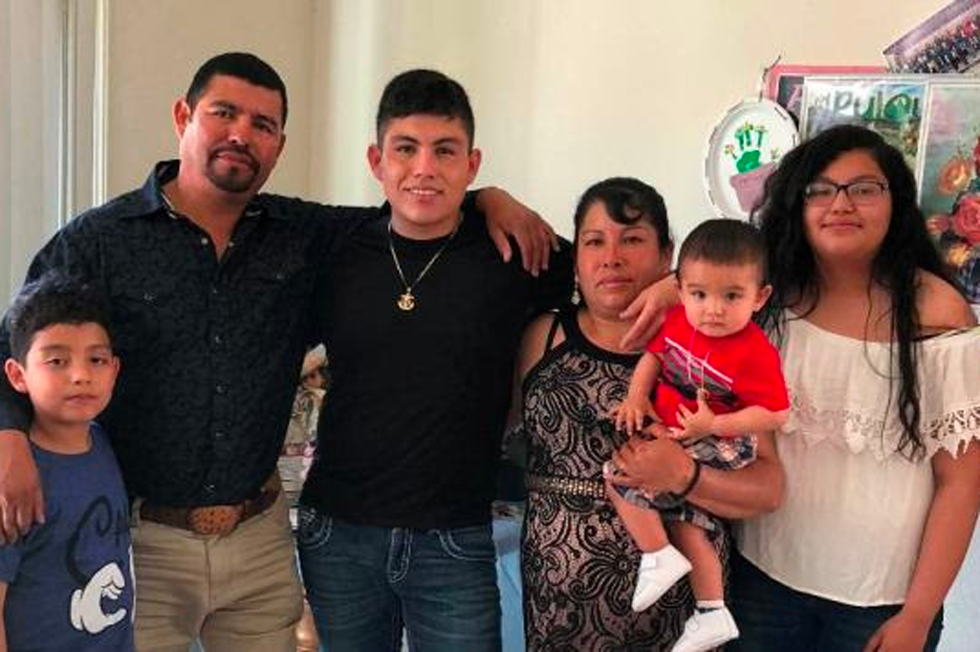 Pictured in the middle is Lazaro, a DACA holder, and his family